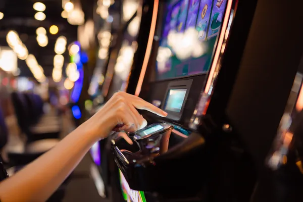 A young woman relaxing with her phone while dynamic casino elements float around her, illustrating the smooth mobile experience offered by the BEFFURY app.