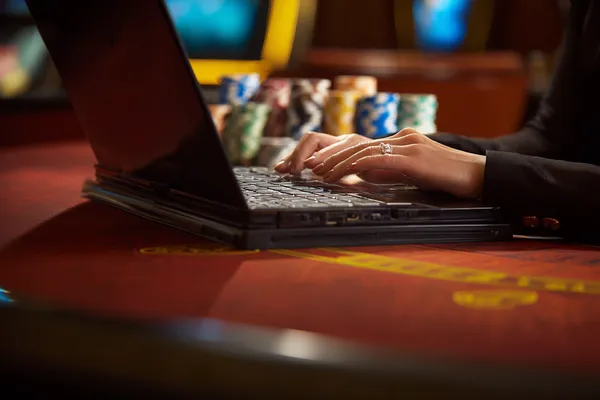 A glowing roulette wheel with cascading chips, symbolizing the engaging live and instant-win games available on BEFFURY.